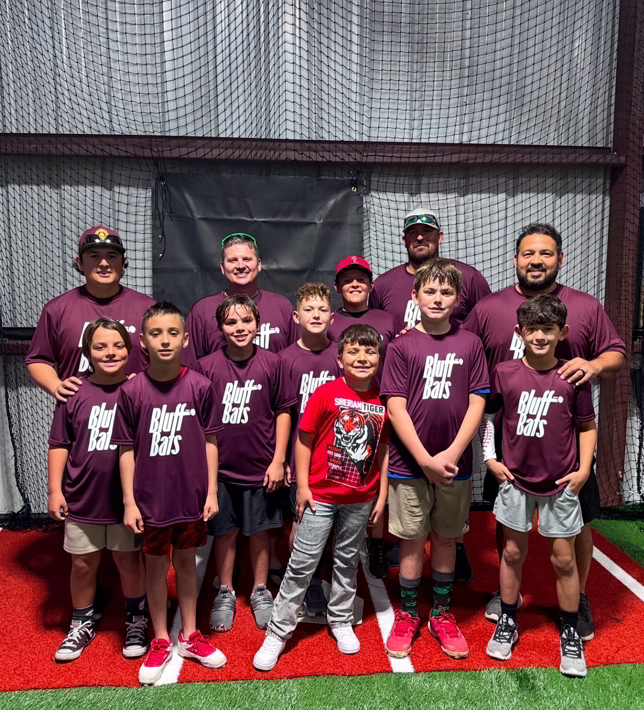 Black and white photo of a women performing modern dance on a dark background.
