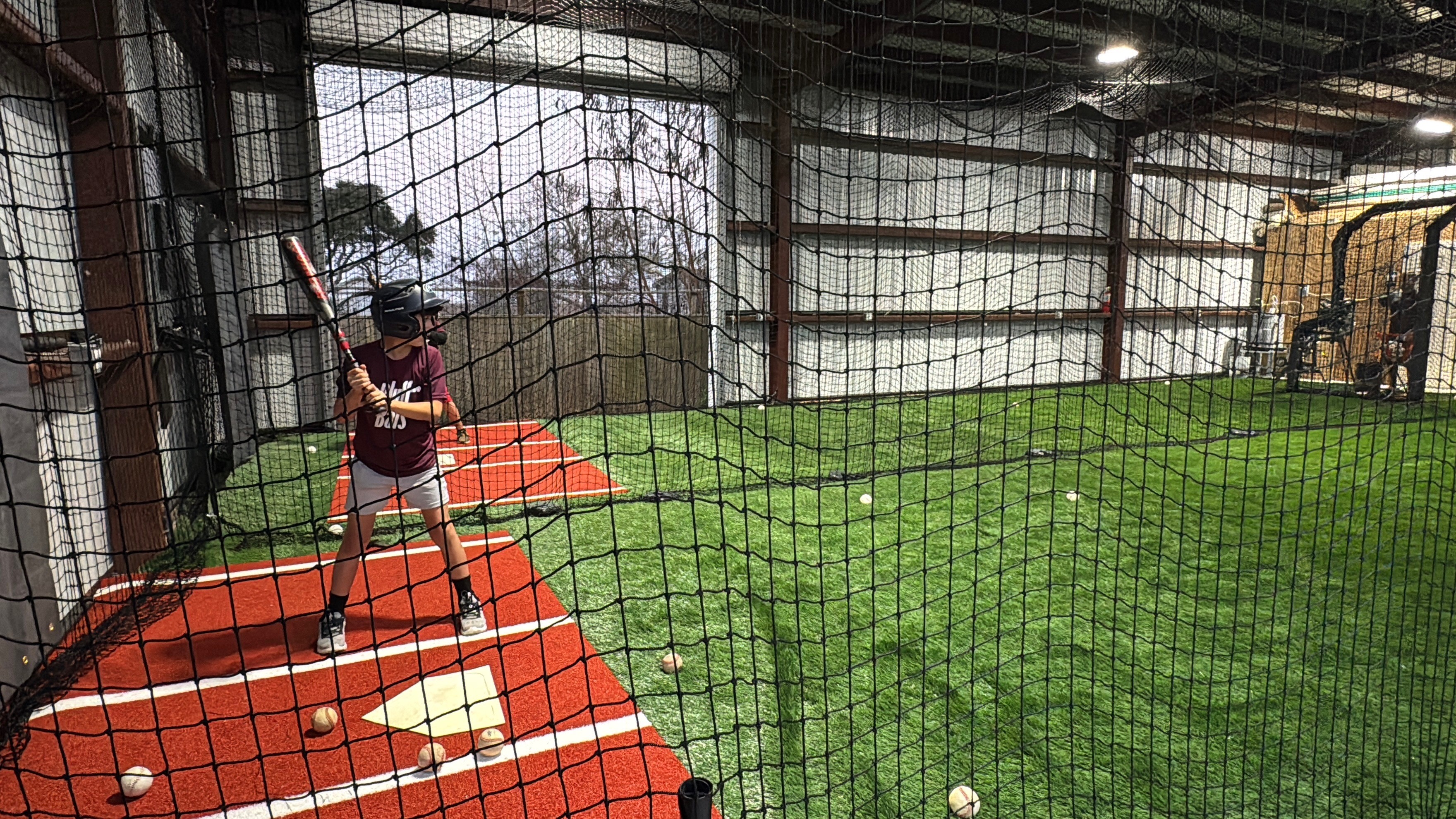 Black and white photo of teens rehearsing a dance routine on a stage.
